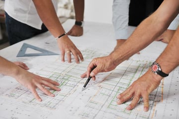 Team of architects people in group  on construciton site check documents and business workflow